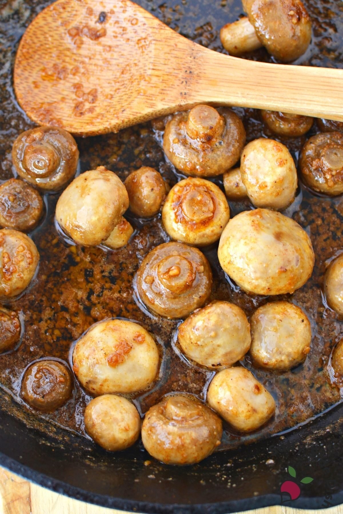 cast iron pan of mushrooms and garlic.