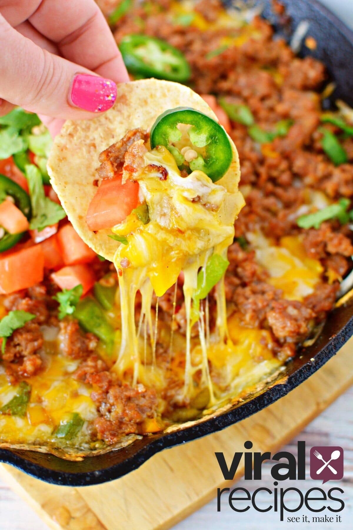 tortilla dip in loaded queso dip.
