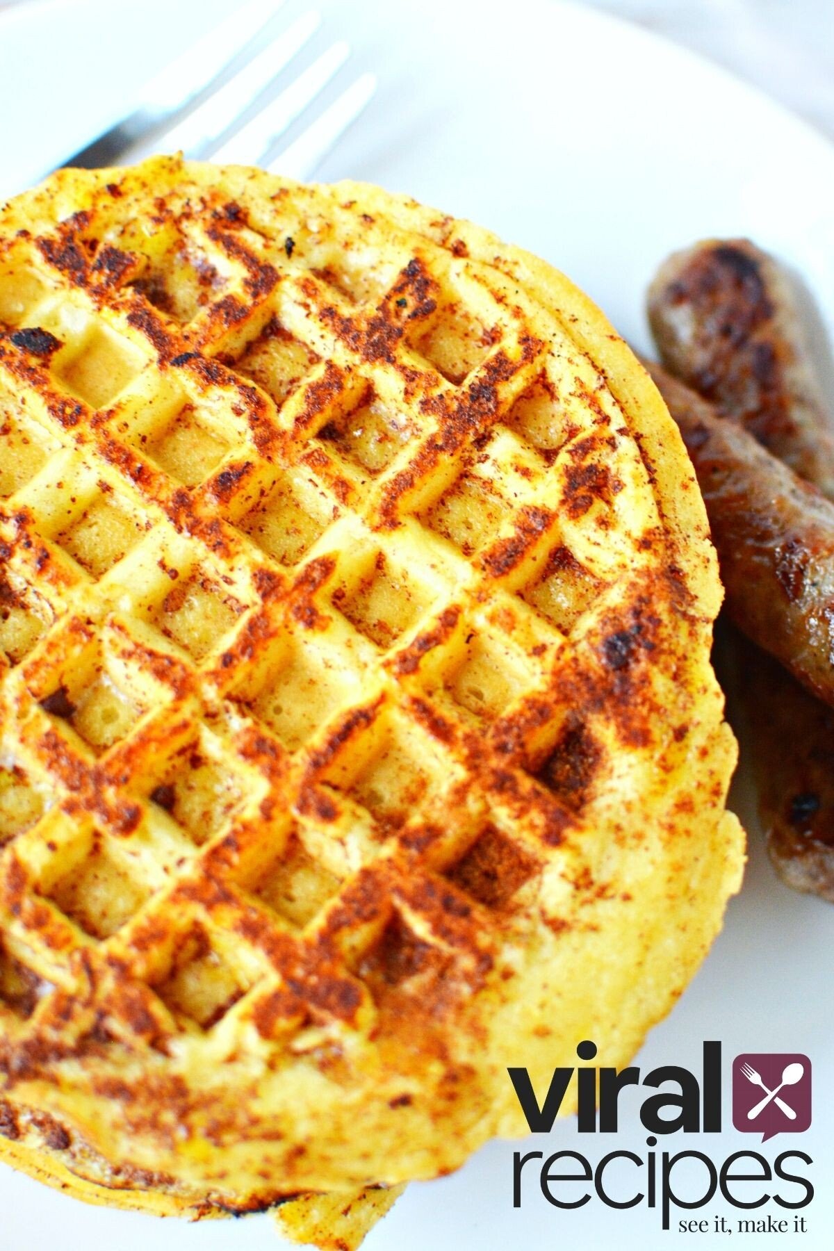 easy french toast waffles in a plate w/ sausage on the side.