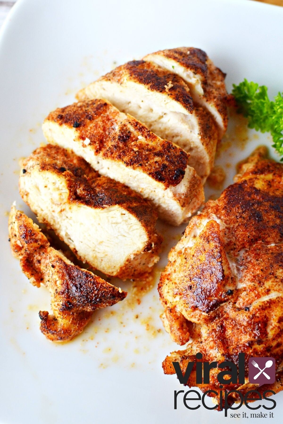 chicken breasts cooked on a plate.