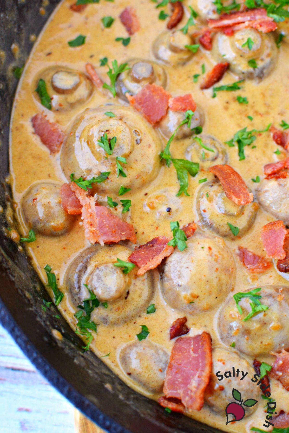 cast iron skillet with tuscan mushrooms in creamy butter garlic sauce..