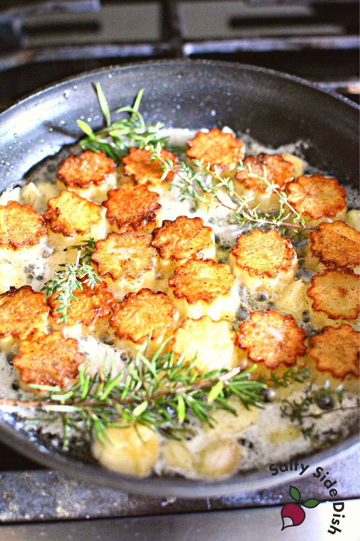 making fondant potatoes in a skillet.