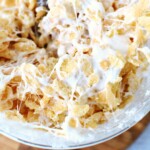 marshmallows and krispie treats in a mug.