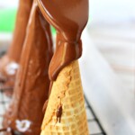 pouring chocolate on cones.