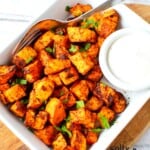 sweet potatoes on a plate ready to eat with dipping sauce.