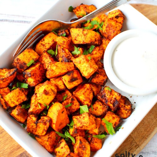 sweet potatoes on a plate ready to eat with dipping sauce.
