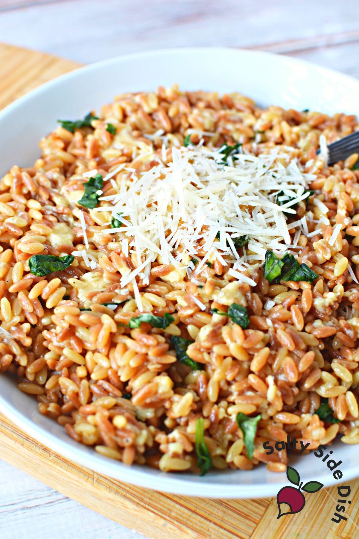 orzo recipe on a plate with parmesan.