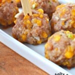 easy delicious sausage ball appetizer recipe with cheddar cheese.