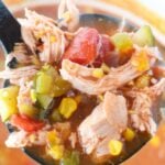 close up of chicken enchilada soup with zucchini and corn.