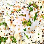 feta fried egg cooked in skillet.