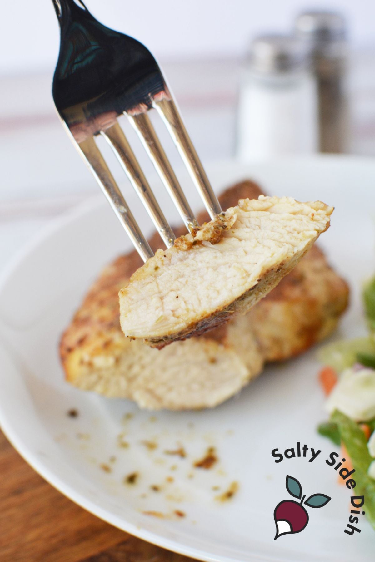cut piece of chicken on a fork.