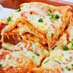 close up picture of layered american lasagna on a spatula.