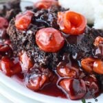 large plate of cherry and chocolate dump cake.