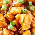 close up of orange chicken pieces.