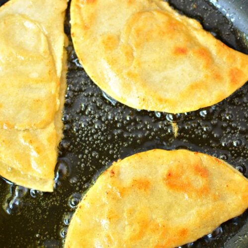 frying tacos in a skillet.