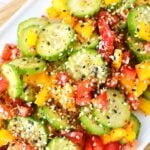 everything bagel cucumber and bell pepper salad on a plate.