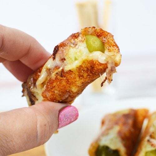 tiny wrapped pickles with cheese.