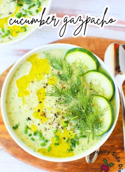 Fresh cucumber gazpacho served in a bowl with dill and chives.