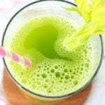 close up of celery juice in a tall glass.