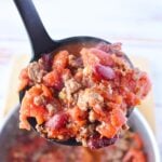 serving chili for one in a ladle.