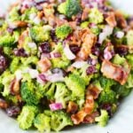 broccoli salad side dish in a white bowl.