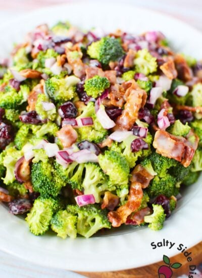 broccoli salad side dish in a white bowl.