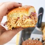 holding a slider in a hand.