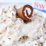 swiss roll cakes on top of dip.