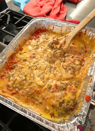 mixing up cheesy queso