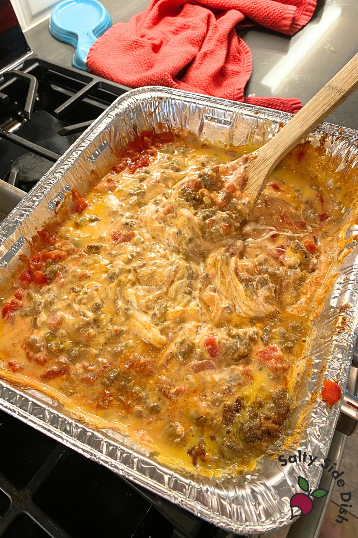 mixing up cheesy queso