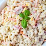huge bowl of chickpea pasta salad with corn, macaroni and chickpeas.