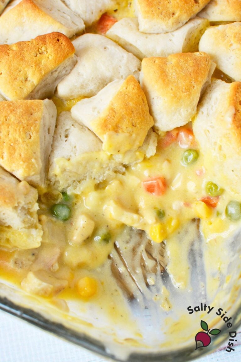 Creamy chicken pot pie filling with vegetables and baked biscuits.