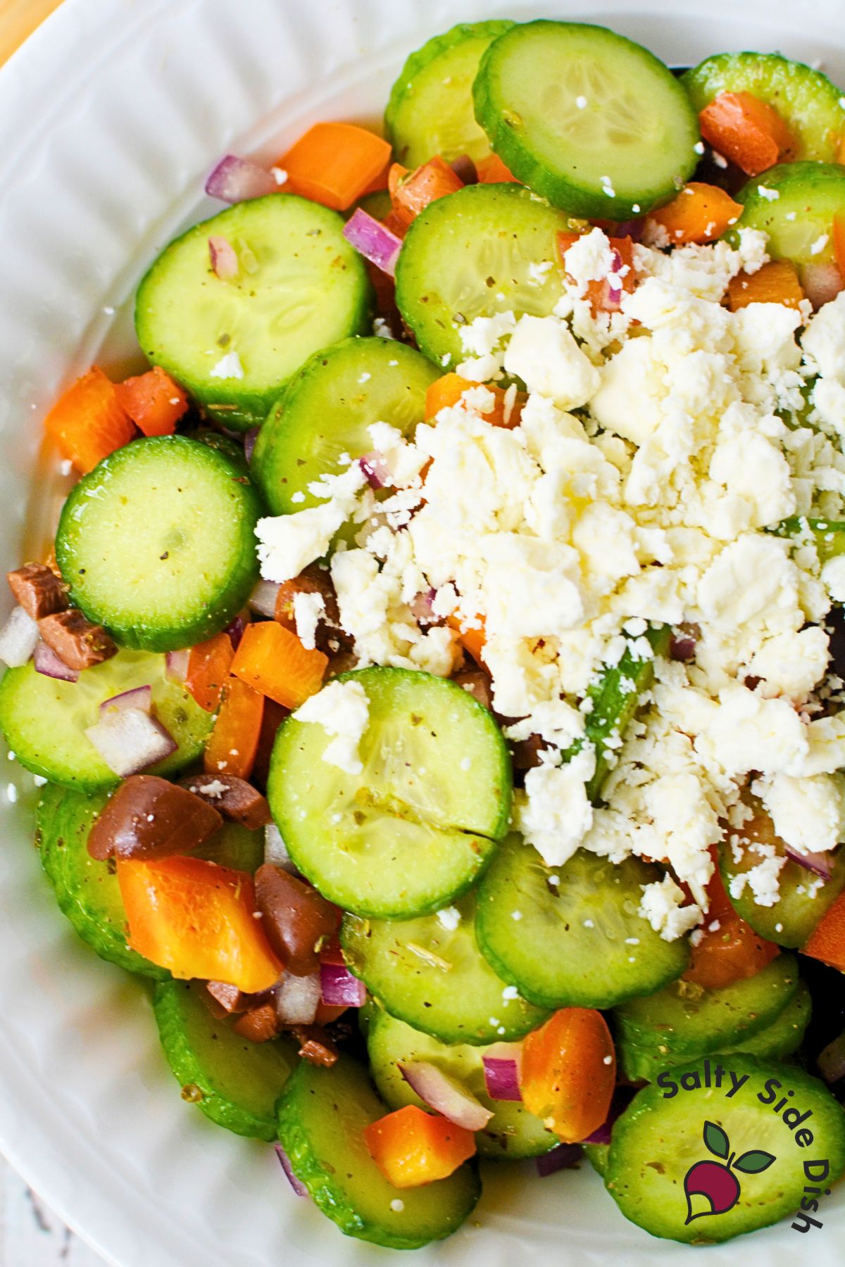 Mediterranean Cucumber Salad recipe in a white bowl.
