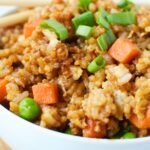 Extreme close-up of jasmine fried rice showing texture and diced vegetables