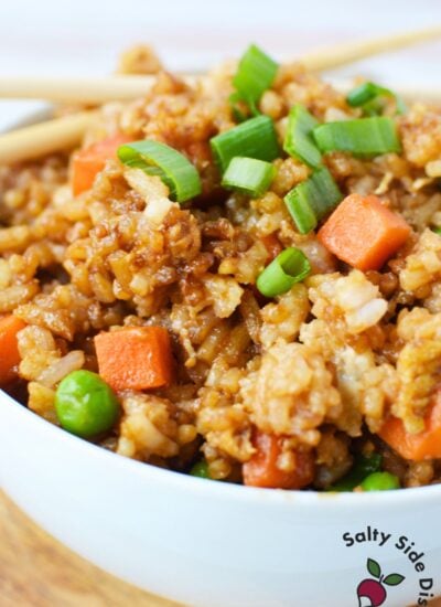 Extreme close-up of jasmine fried rice showing texture and diced vegetables