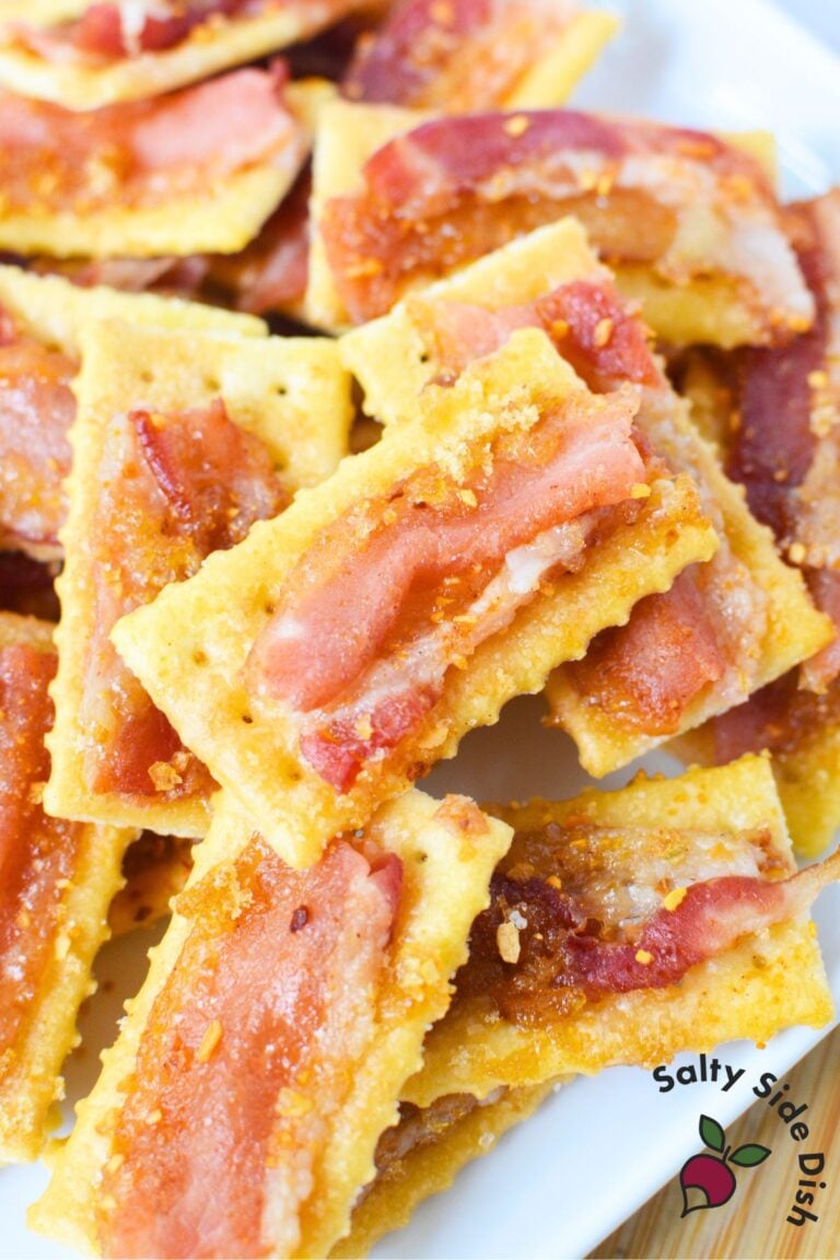 Pile of golden club crackers topped with crispy brown sugar bacon, ready for a party tray