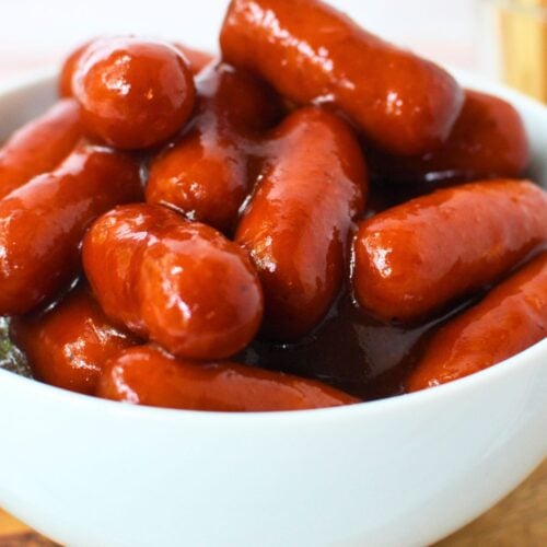Barbecue glazed little smokies served in a white bowl