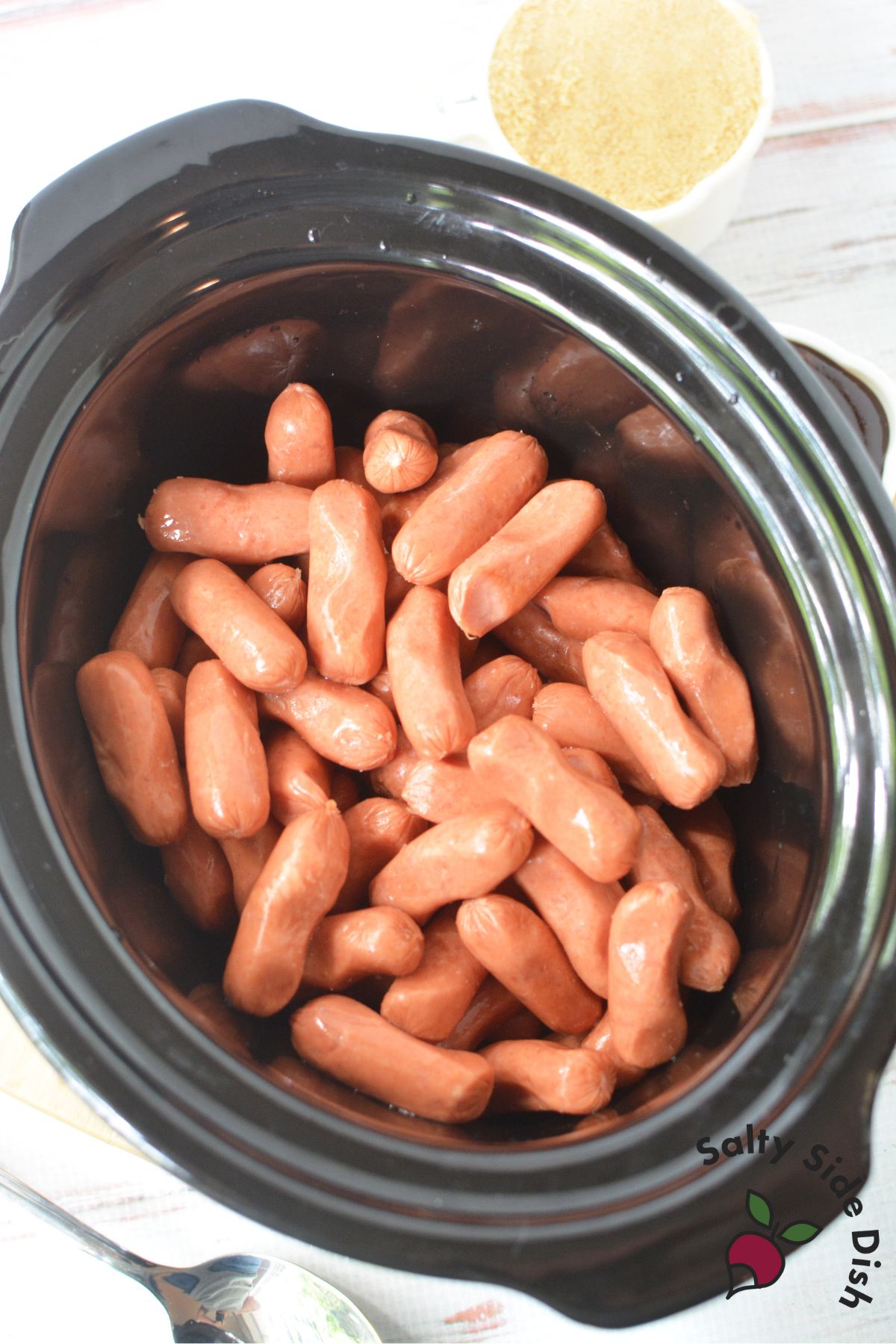 Cocktail sausages in a slow cooker before adding sauce