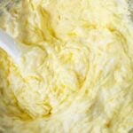 Close-up of pineapple and pudding fruit dip after mixing, showing creamy whipped texture