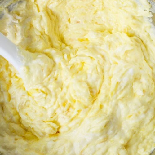 Close-up of pineapple and pudding fruit dip after mixing, showing creamy whipped texture