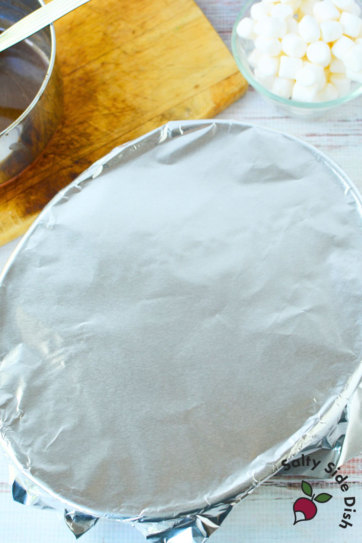 Scalloped sweet potato casserole covered with foil before baking