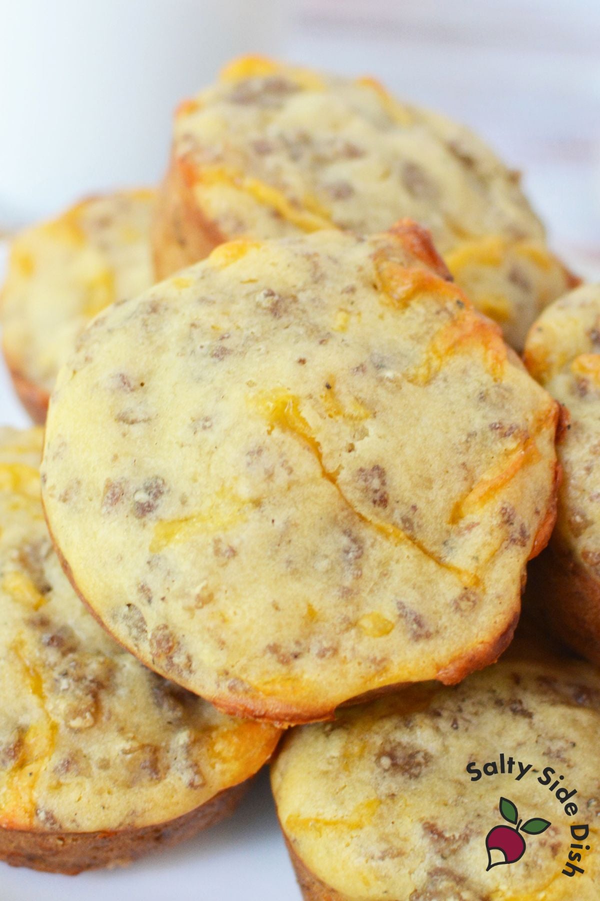 Close up of homemade McGriddle muffins showing sausage and cheese inside