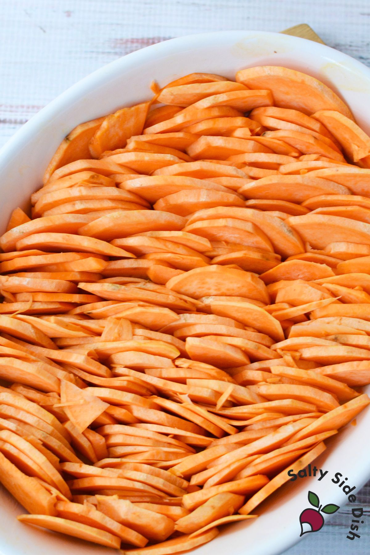 Scalloped sweet potatoes in a baking dish