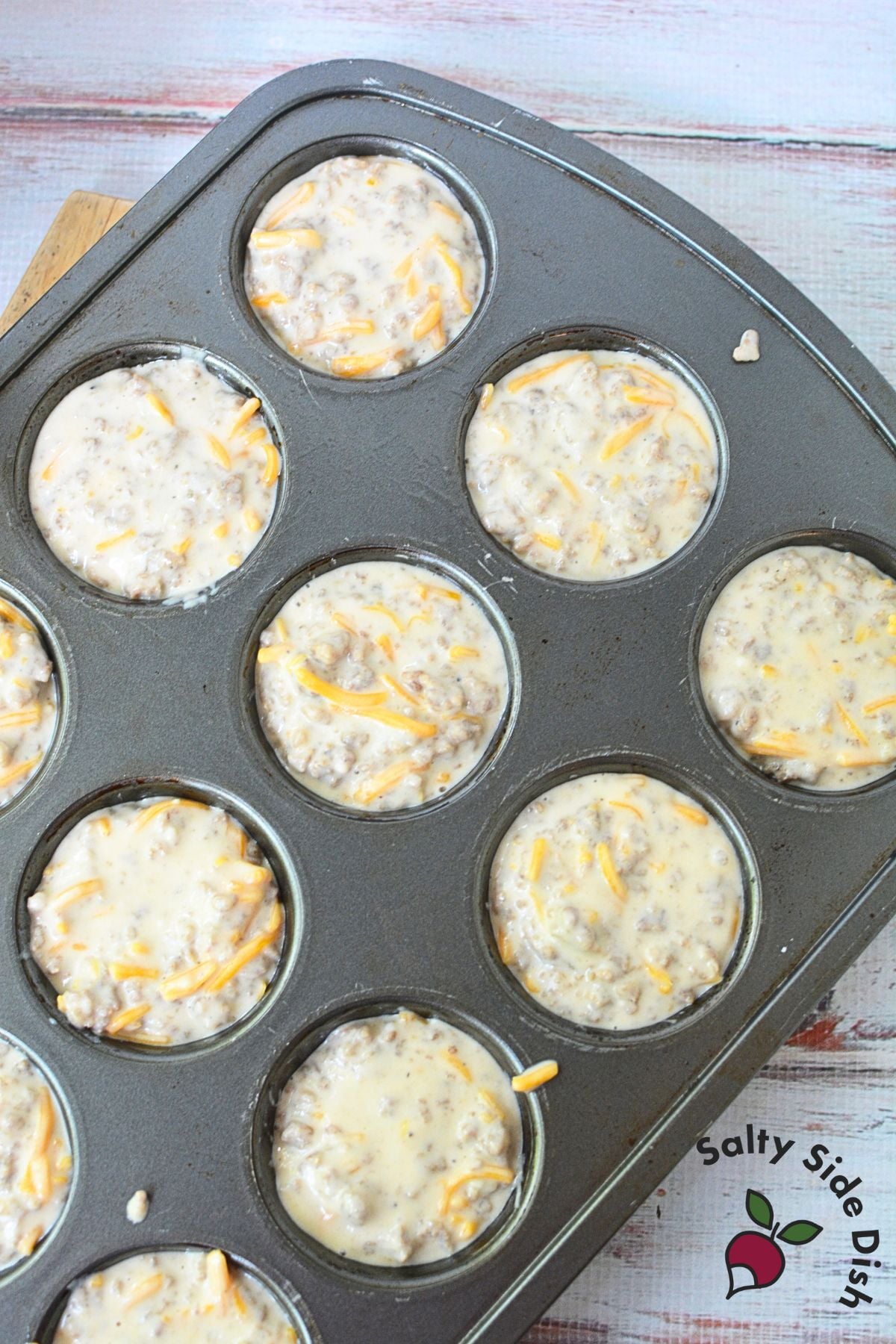 Muffin tin filled with McGriddle muffins batter before baking