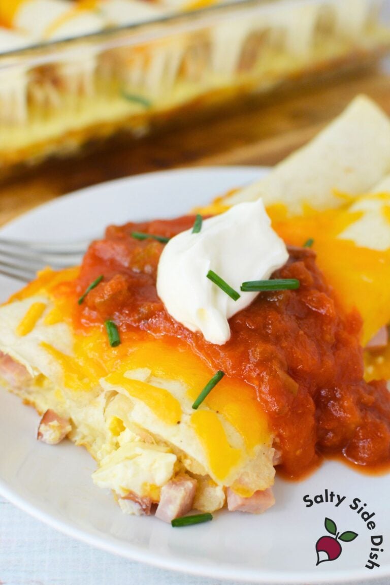 Baked ham and cheese tortillas topped with salsa, sour cream, and chives for a hearty brunch recipe.