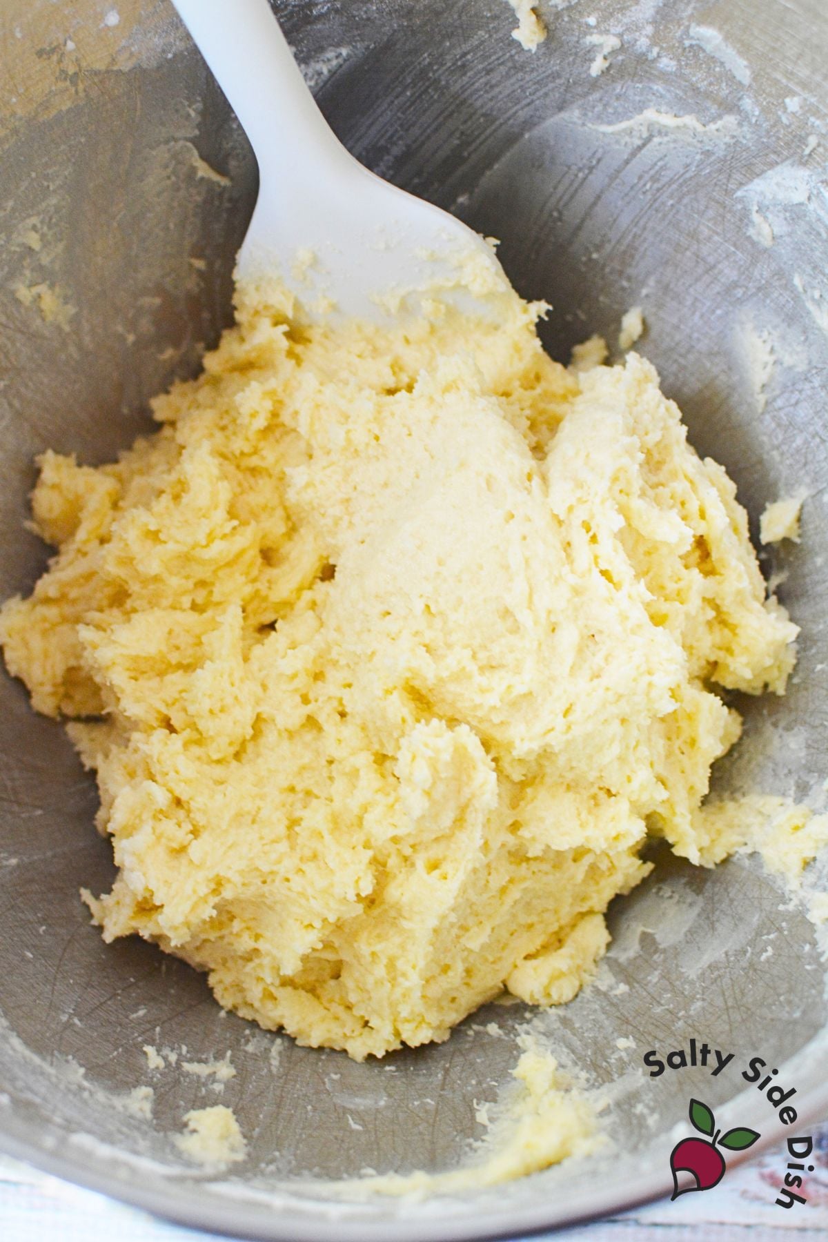 Mixing cake batter for homemade peach upside down cake