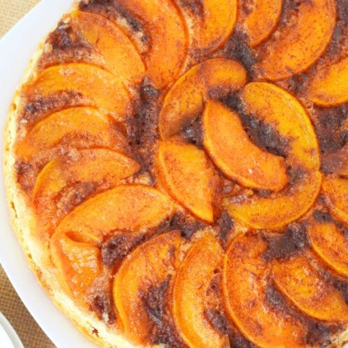 Whole peach upside down cake baked with caramelized topping