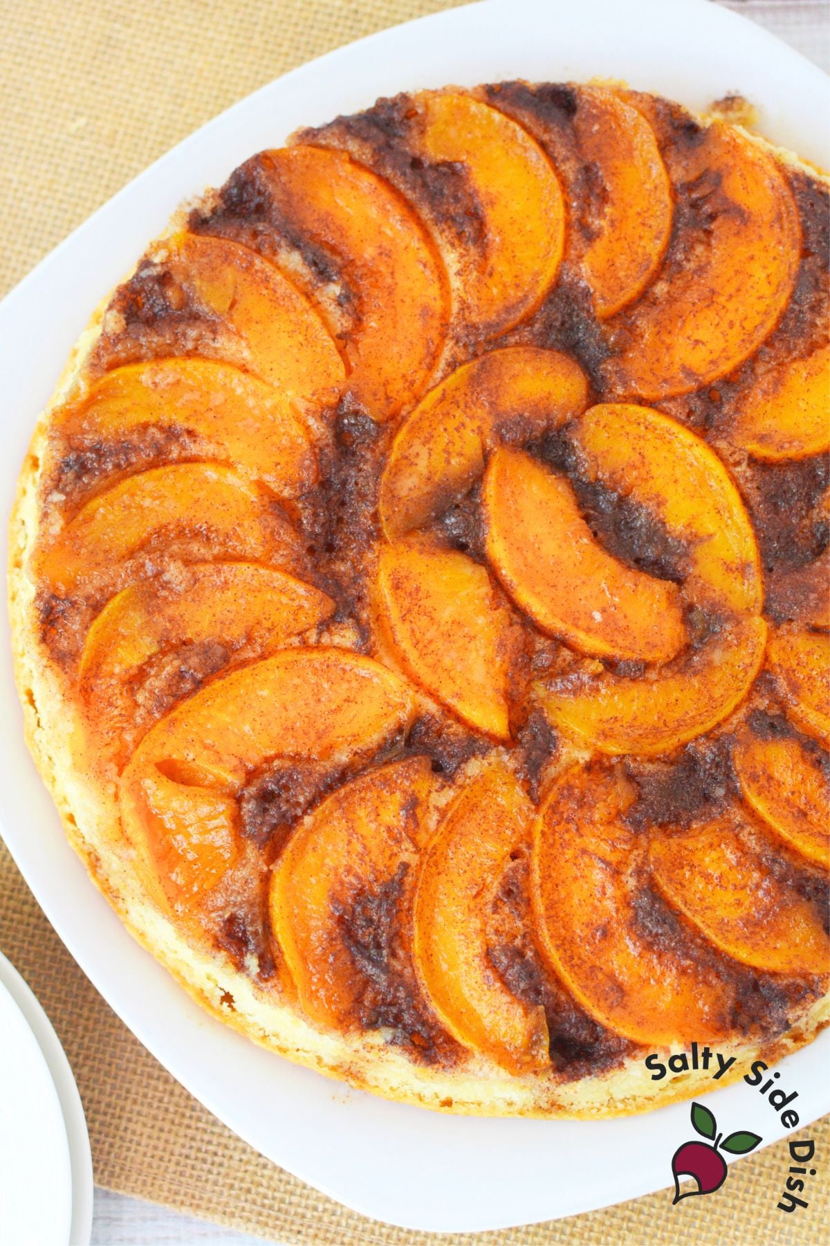 Whole peach upside down cake baked with caramelized topping