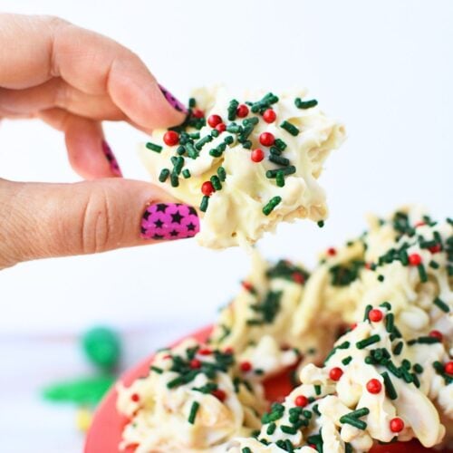 Holiday no bake haystack cookies topped with green and red sprinkles on baking sheet