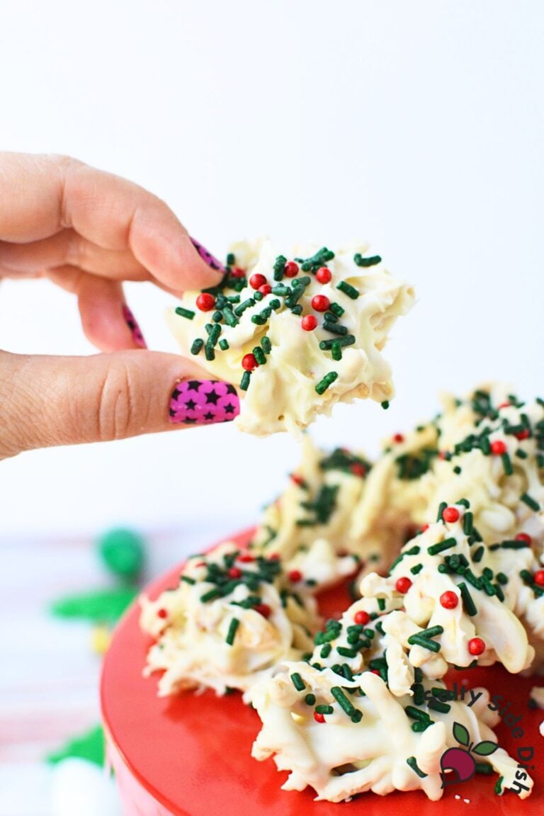 Holiday no bake haystack cookies topped with green and red sprinkles on baking sheet